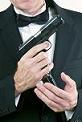 man with dinner jacket and gun man with dinner jacket and gun